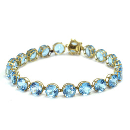 14k yellow gold round blue topaz tennis bracelet