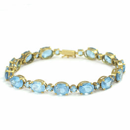 14k yellow gold oval and round blue topaz tennis bracelet