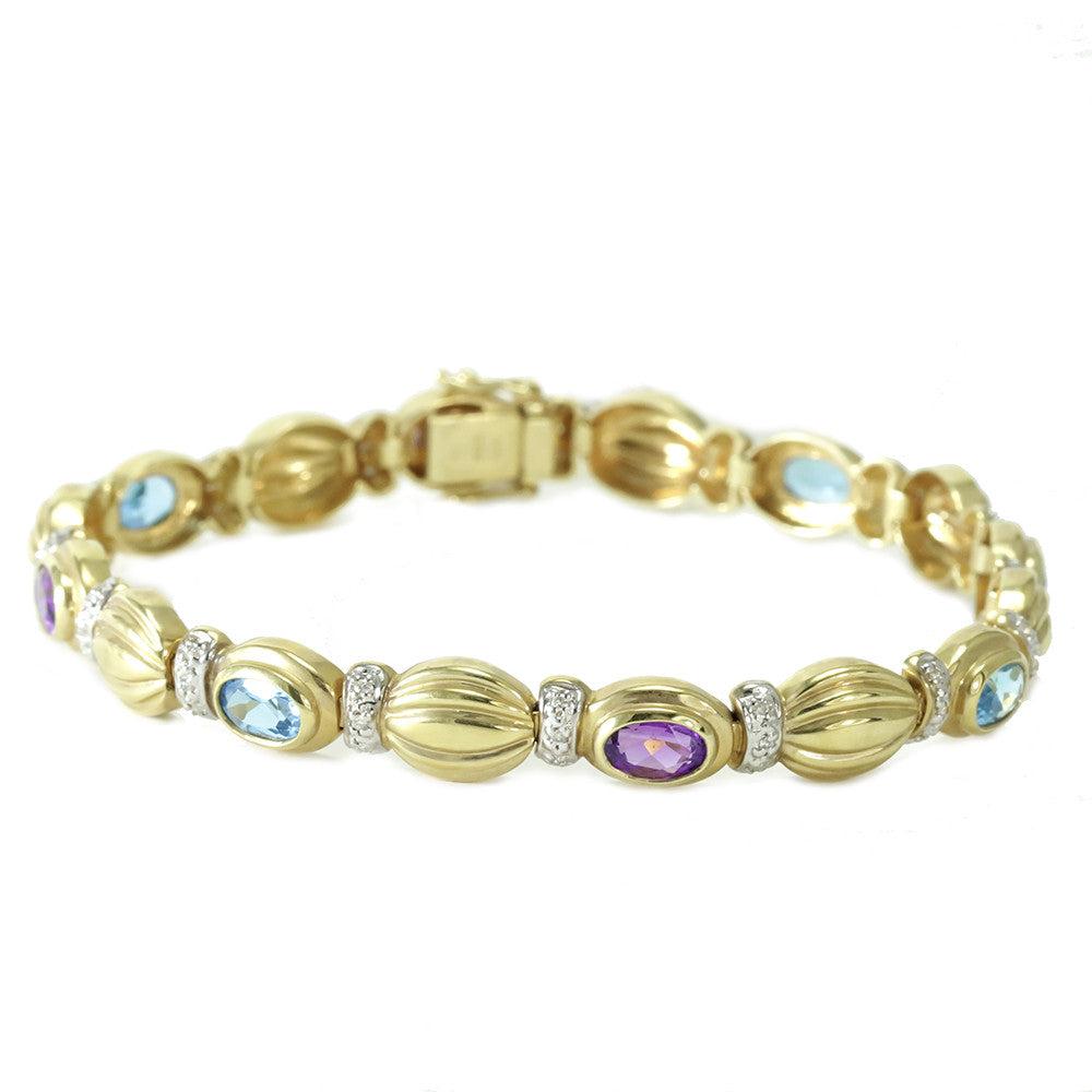14k yellow gold blue topaz, amethyst and diamonds tennis bracelet